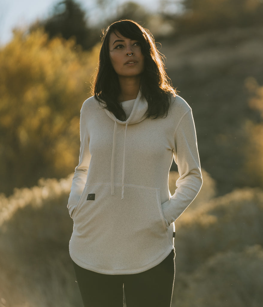A woman wearing Tallac Pullover in winter white by Deso Supply Co.