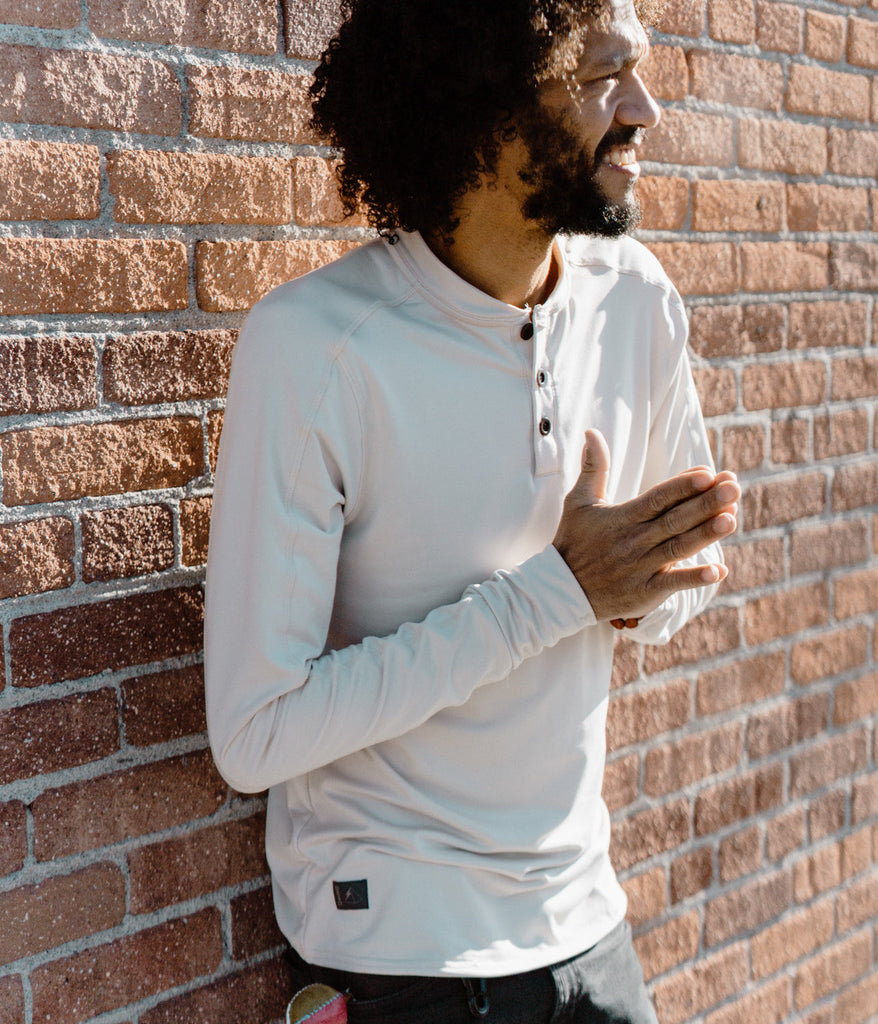 A man wearing a Benton long sleeves in white sand color by Deso Supply Co.