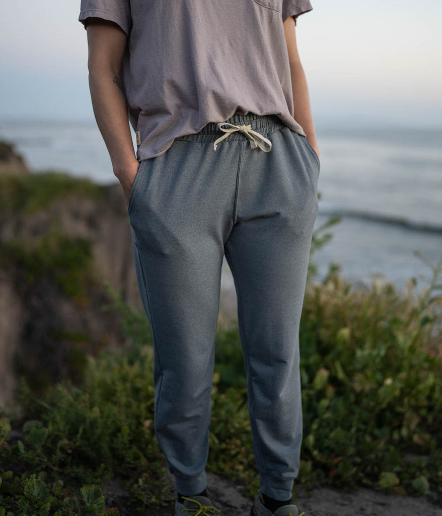 A close-up of a woman wearing the Madora Jogger in heather slate color by Deso Supply Co.