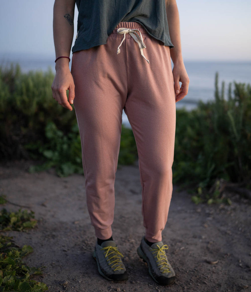 A close-up of a woman wearing the Madora Jogger in heather claypot color by Deso Supply Co.