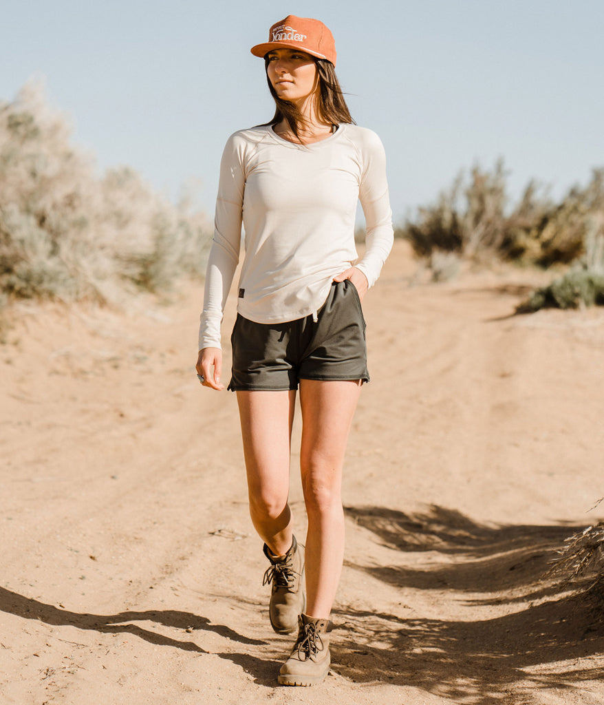 A woman outdoors wearing the Madora Short in forest black color by Deso Supply Co. 3