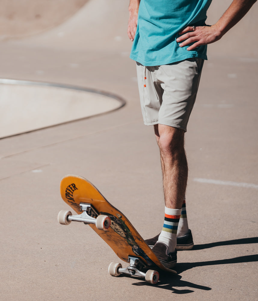 A man on a skateboard wearing Boca Board Shorts in mist color by Deso Supply Co.