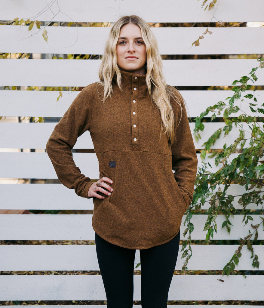A woman wearing Genevieve Snap Pullover 6s in sandstone color by Deso Supply Co.