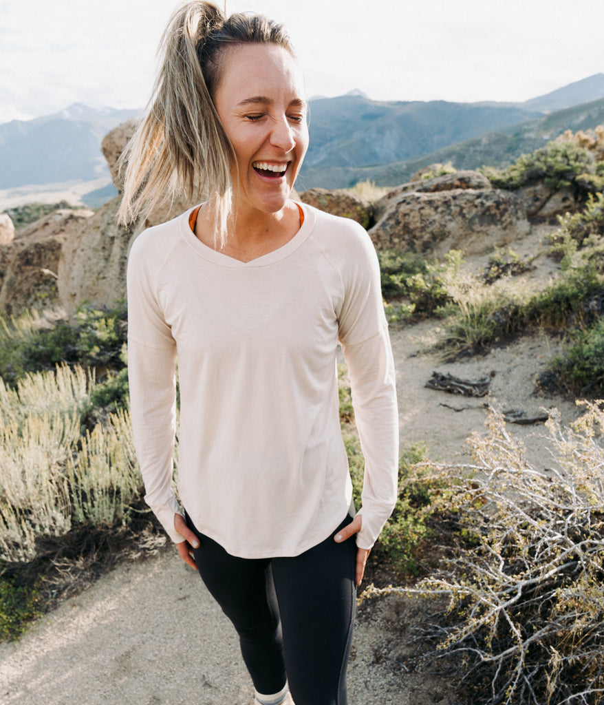 A smiling woman wearing Shirley Long Sleeve by Deso supply co.