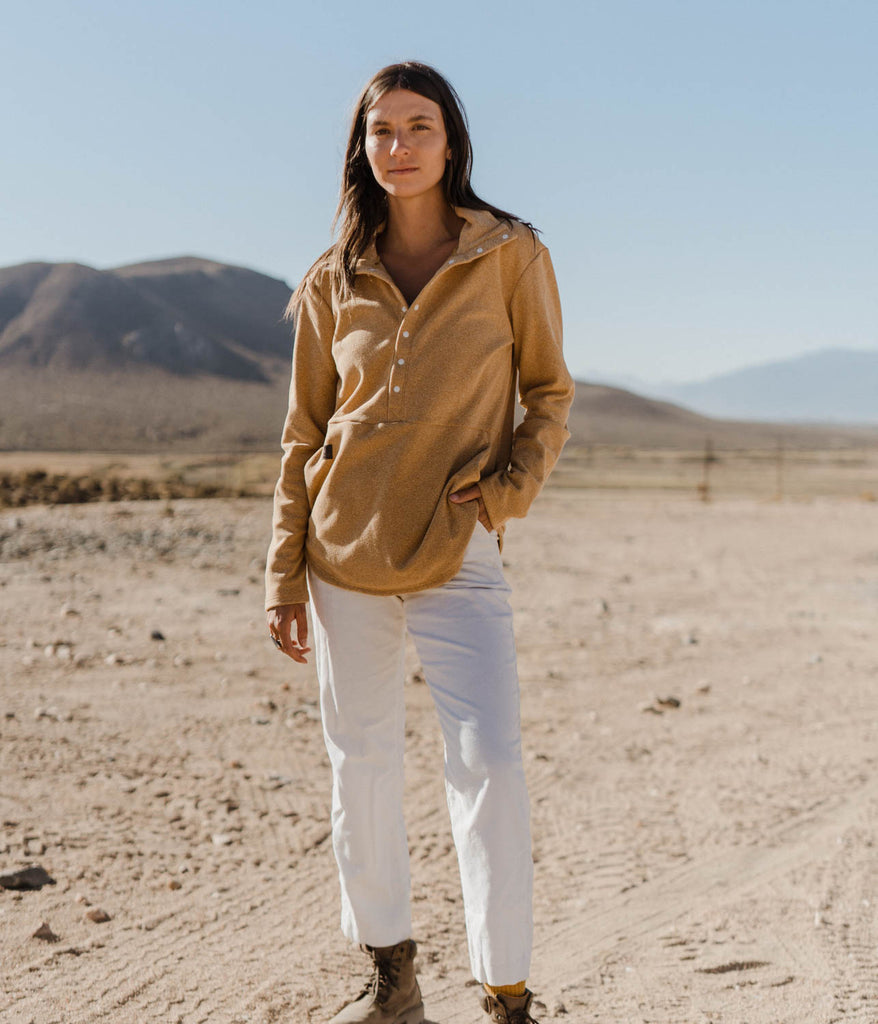 A woman wearing Genevieve Snap Pullover 8s in desert camel color by Deso Supply Co.