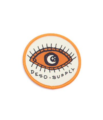 Eye of the wilderness sew on patch in off white color by Deso Supply Co.
