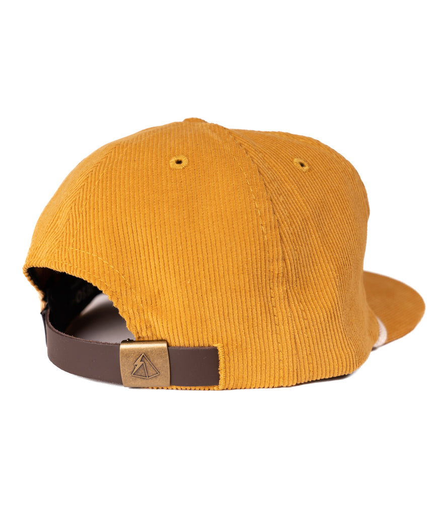 A back view of the Ibis 5 Panel Cap in gold color by Deso Supply Co.