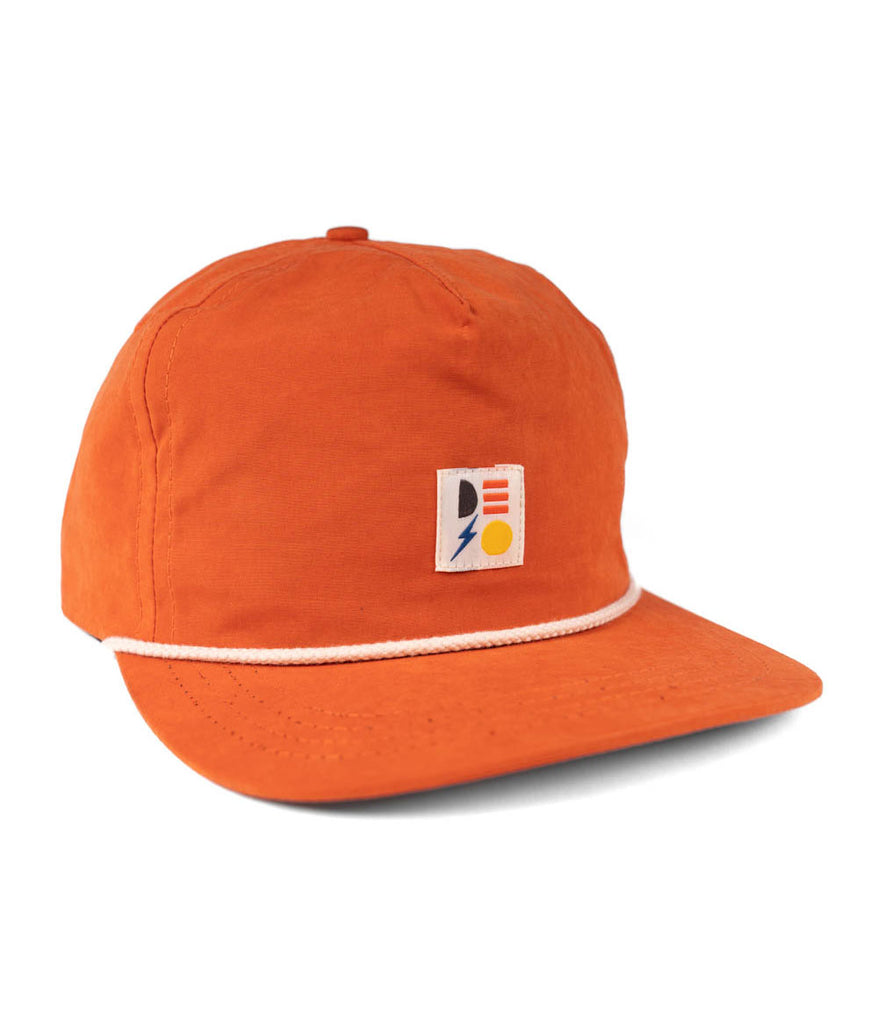 Shapes 5-panel cap in deep brick color by Deso Supply Co.