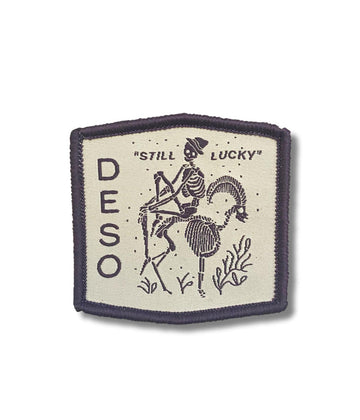 Still Lucky Patch - Sew On Patch in purple/white color by Deso Supply Co.